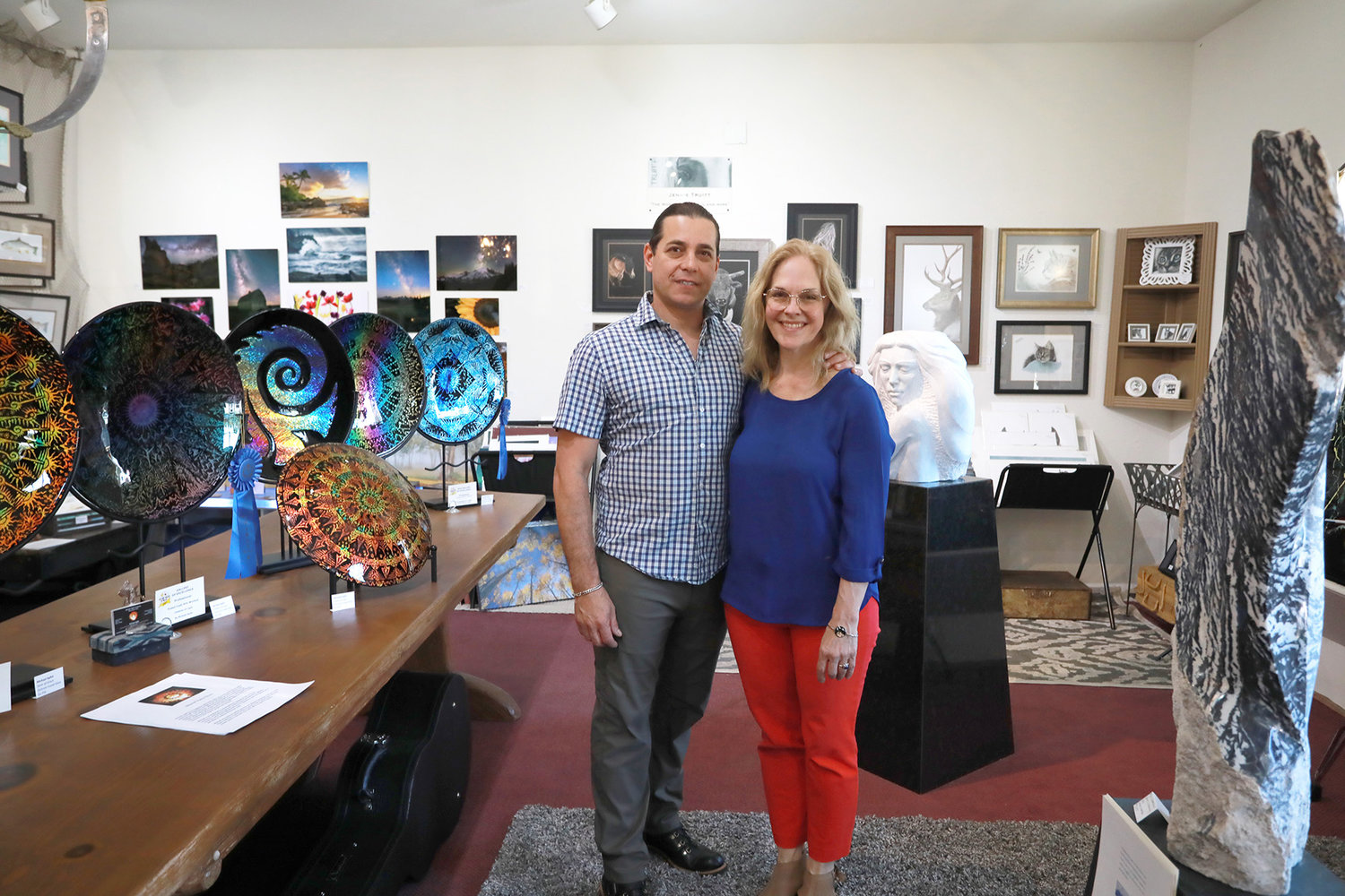 Owners Andrea Levanti and partner Diego Fleitas both artists own the InGenius! gallery. The white statue in the background is also a local artist- Paul Keesler